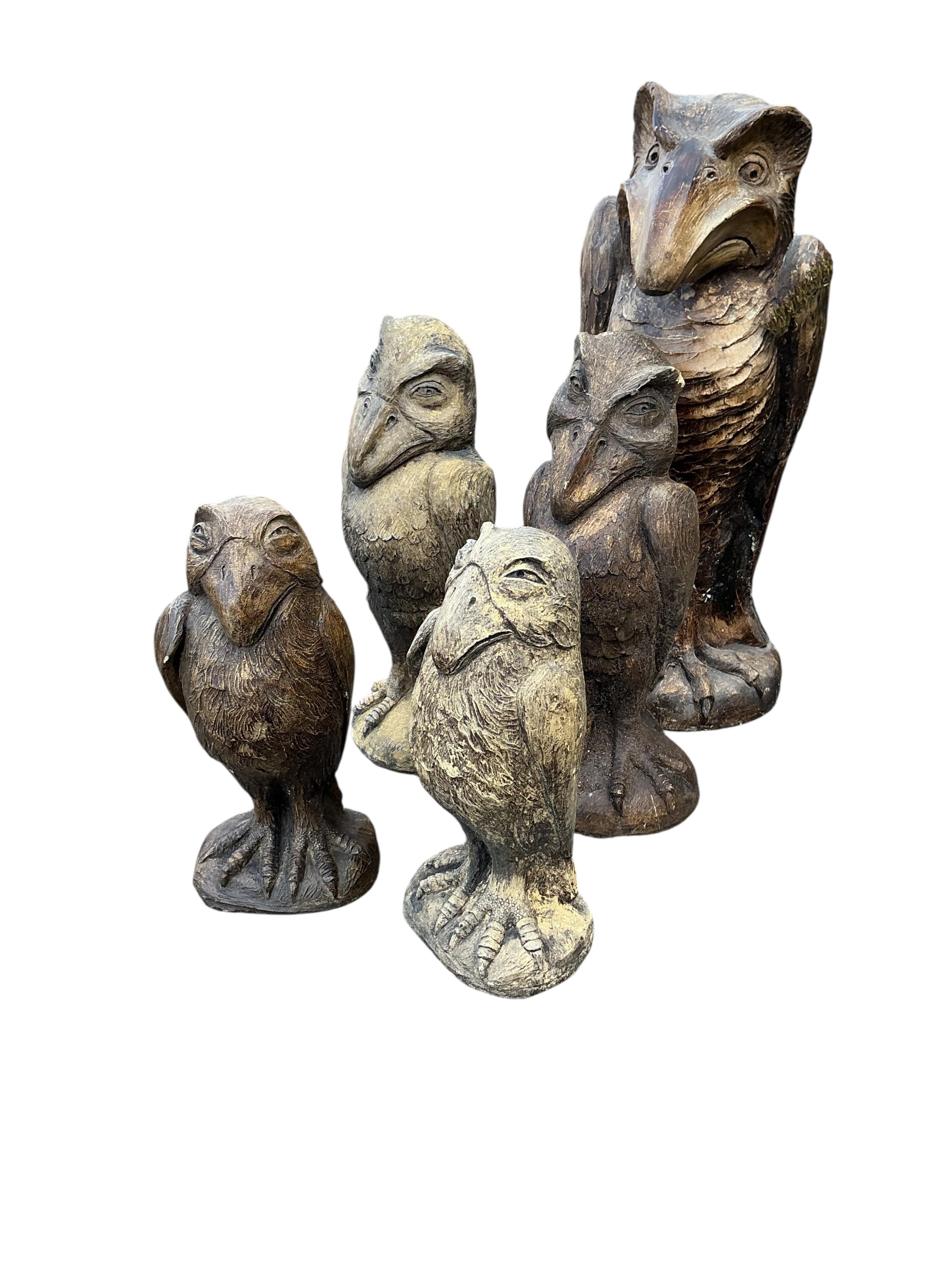Five cast stone 'Wally' bird ornaments in the style of Martin Bros., largest height 48cm